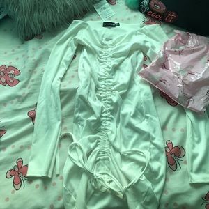 White ribbed long sleeve bodycon dress.